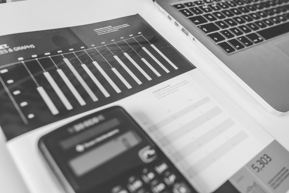 Calculator on a desk representing SEO pricing and budgeting decisions